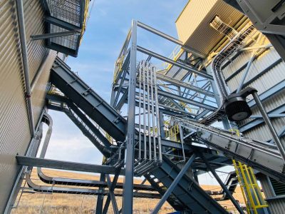 Industrial plant steel structure and conveyor system
