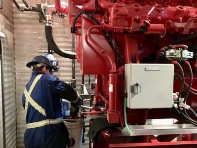 Technician inspecting a fire pump system